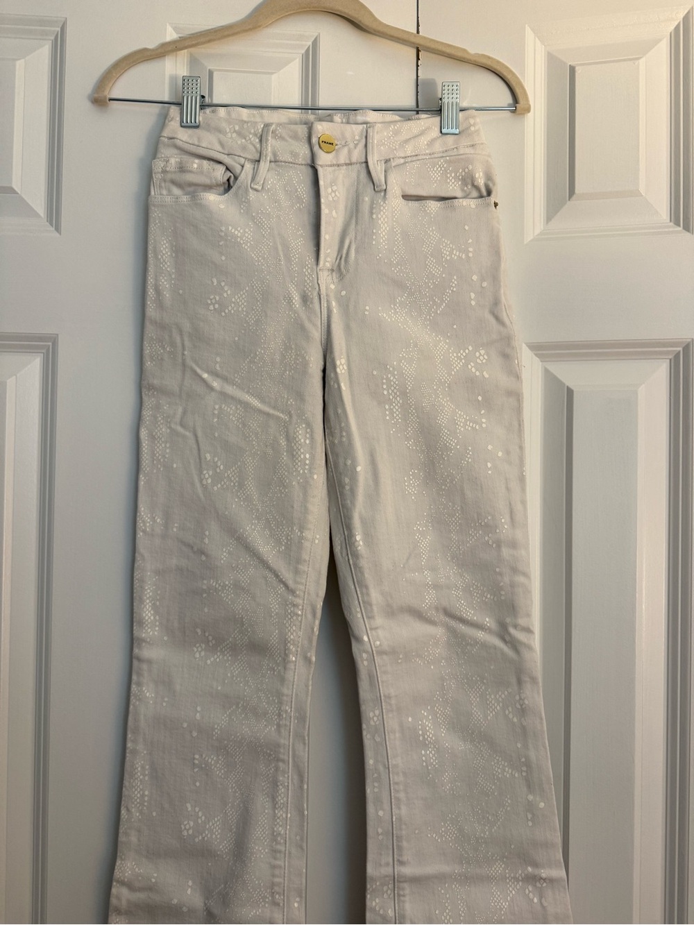 Frame Denim Cream Flare Jeans with Subtle Shimmer